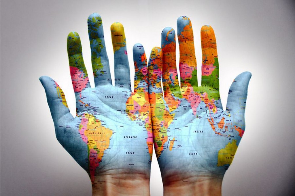 Image of a world map appearing on two open palms