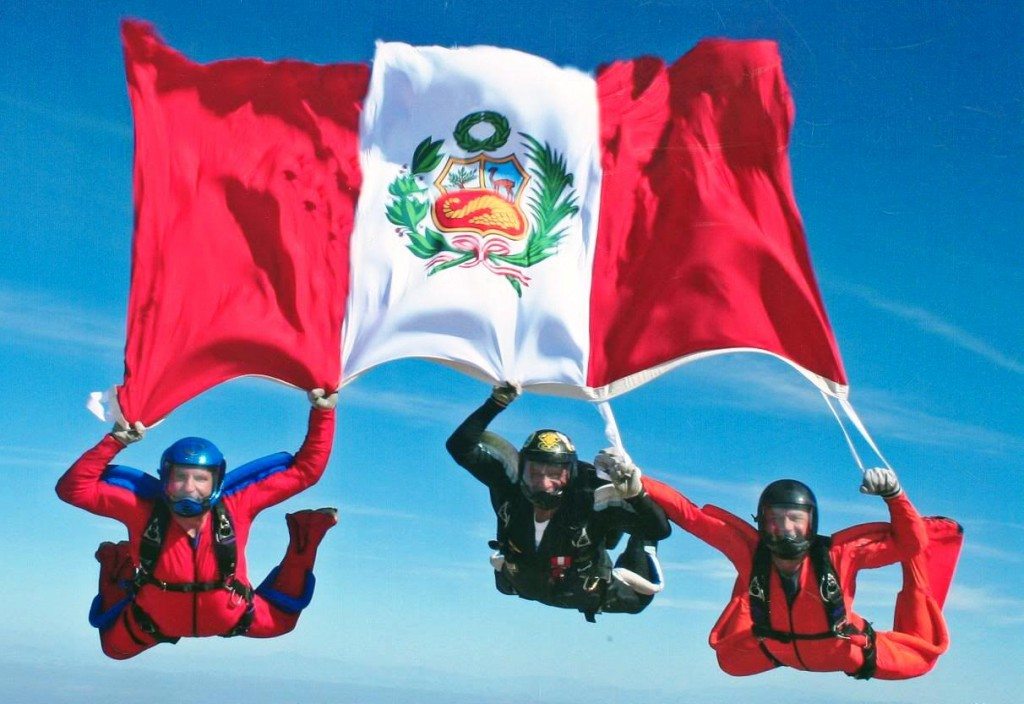  Three people sky diving with a Peruvian Flag Bandera Peruana
