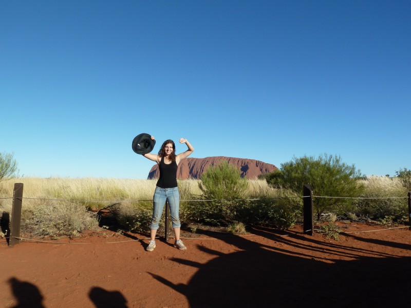 A woman in Front of Uluru