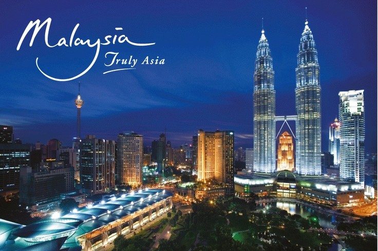 Malaysia city scape at Night with  'Malaysia Truly Asia" slogan