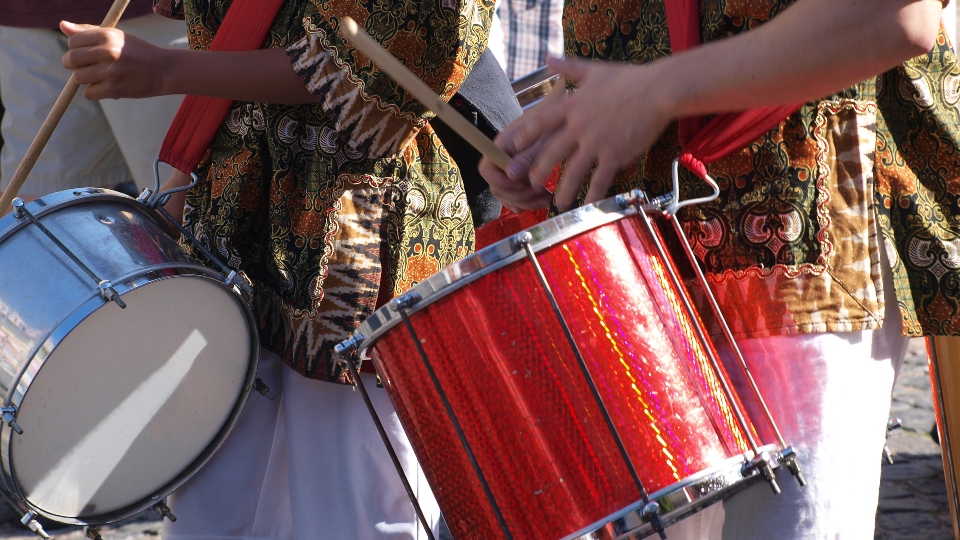 Brazil samba carnival musicians play on drums