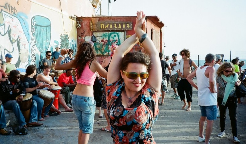 People dancing in the street in Gordon Beach, Tel Aviv
