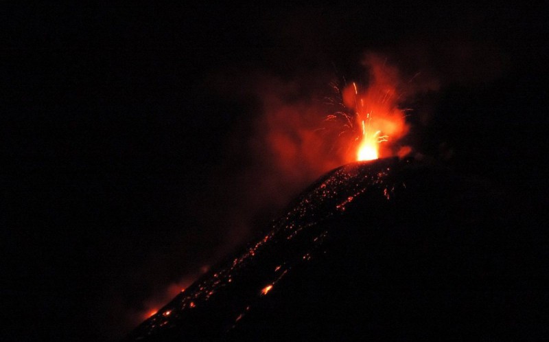 View of the Cotopaxi volcano spewing lava