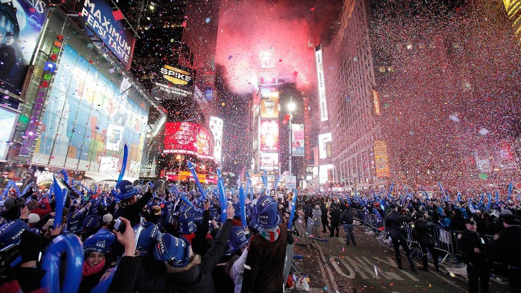 Image: Revellers cheer as confetti falls during New Year celebrations in Times Square in New York