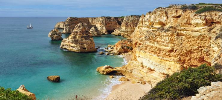A beautiful clifftop view of Praia da Marinha in Portugal, an underrated beach in Europe