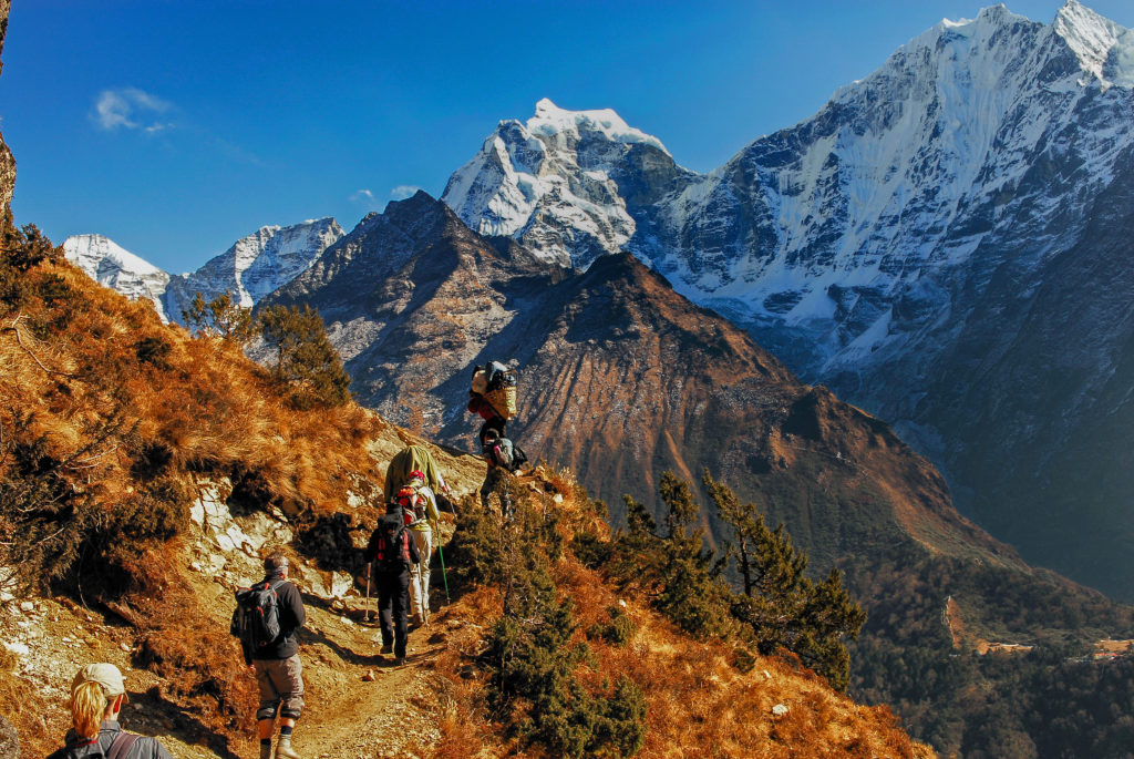 Hikers on a mountain ridge in the Himalayas