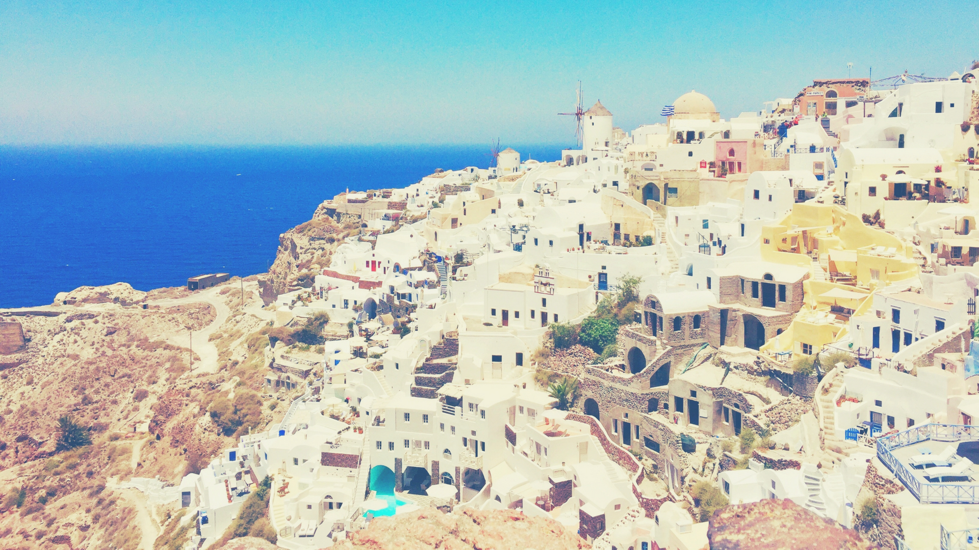 View of the white houses on the hills in Santorini