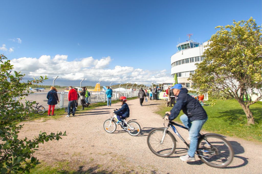 Father and sun riding bikes in Helsinki