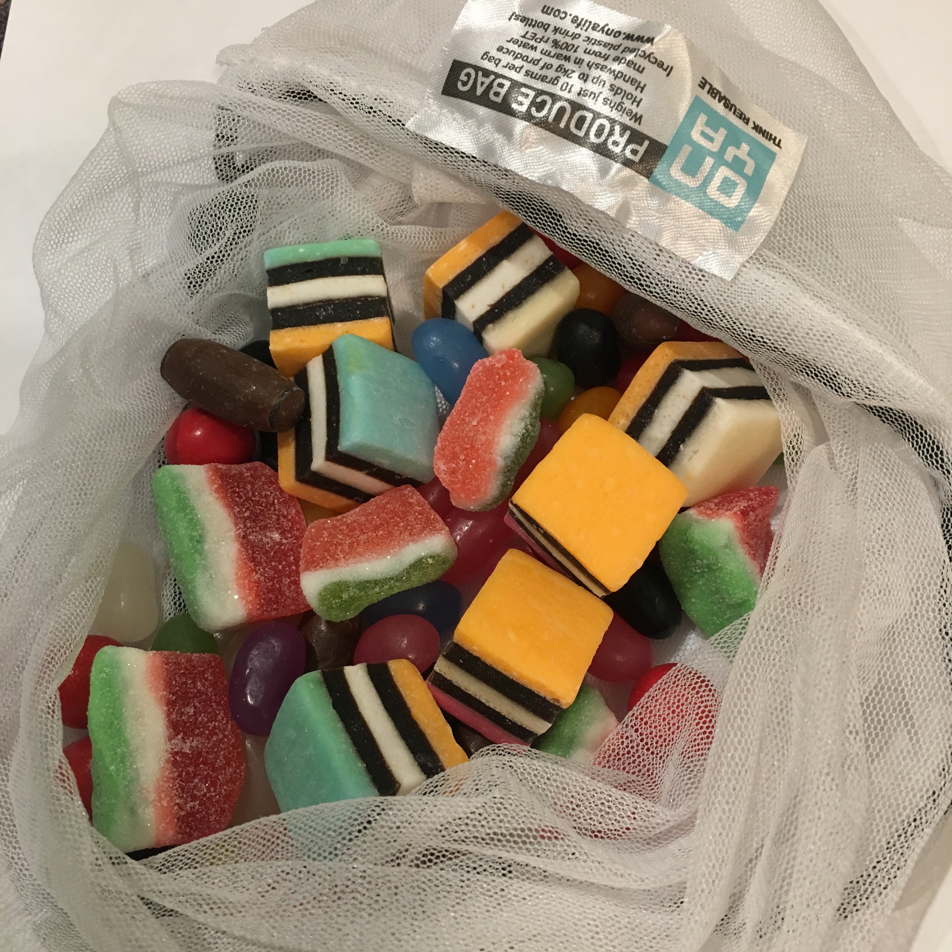 Reusable bag full of mixed lollies