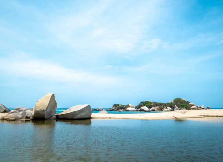 Blue sky, blue sea and white sand on the beach in Tayrona National Park