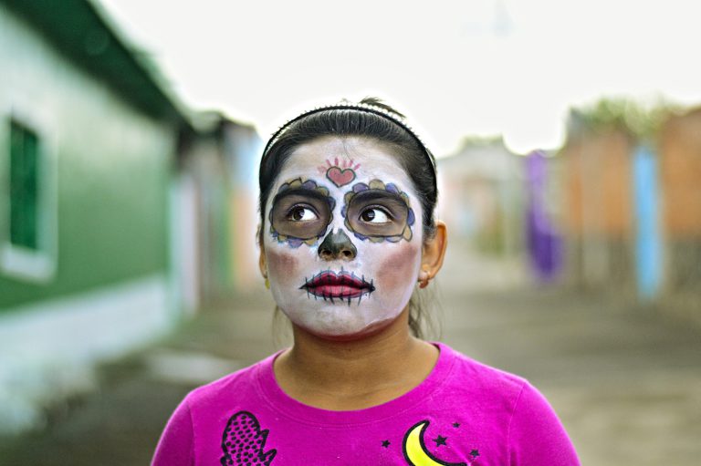 A girl with her face painted as a Calavera Catrina for Mexico's Day of the Dead.