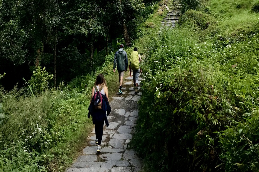 Group of trekkers climbing stairs