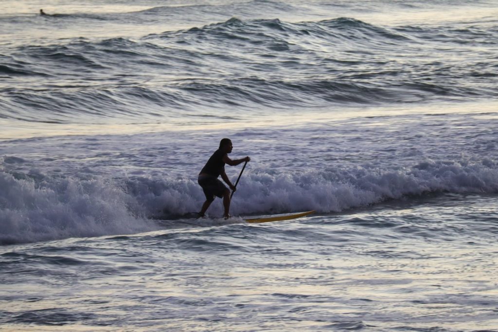 man surfing in hawaii