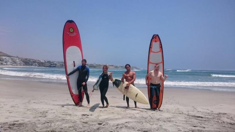 friends surfing peru bamba