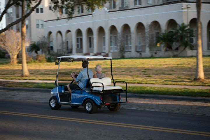 couple in golf cart