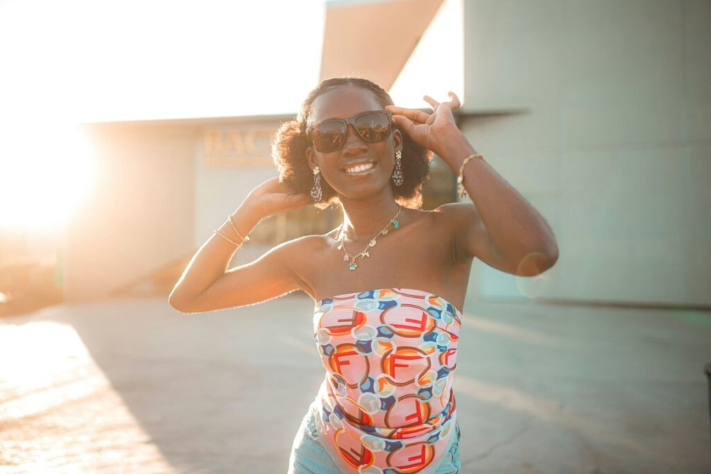 woman wearing sunglasses posing for a picture
